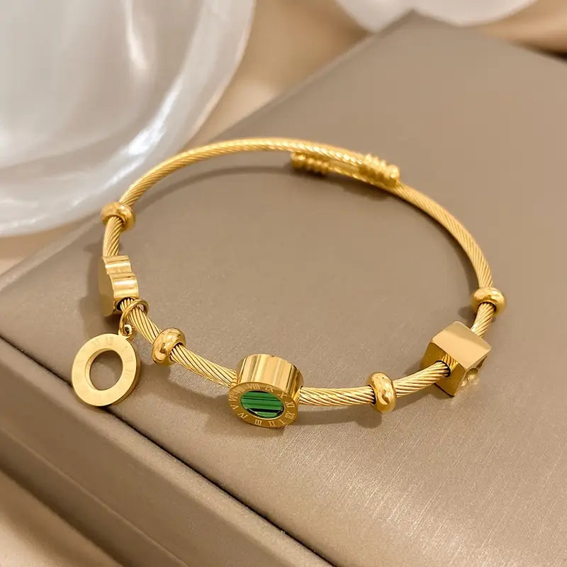 Rhian – Goldenes Signaturarmband
