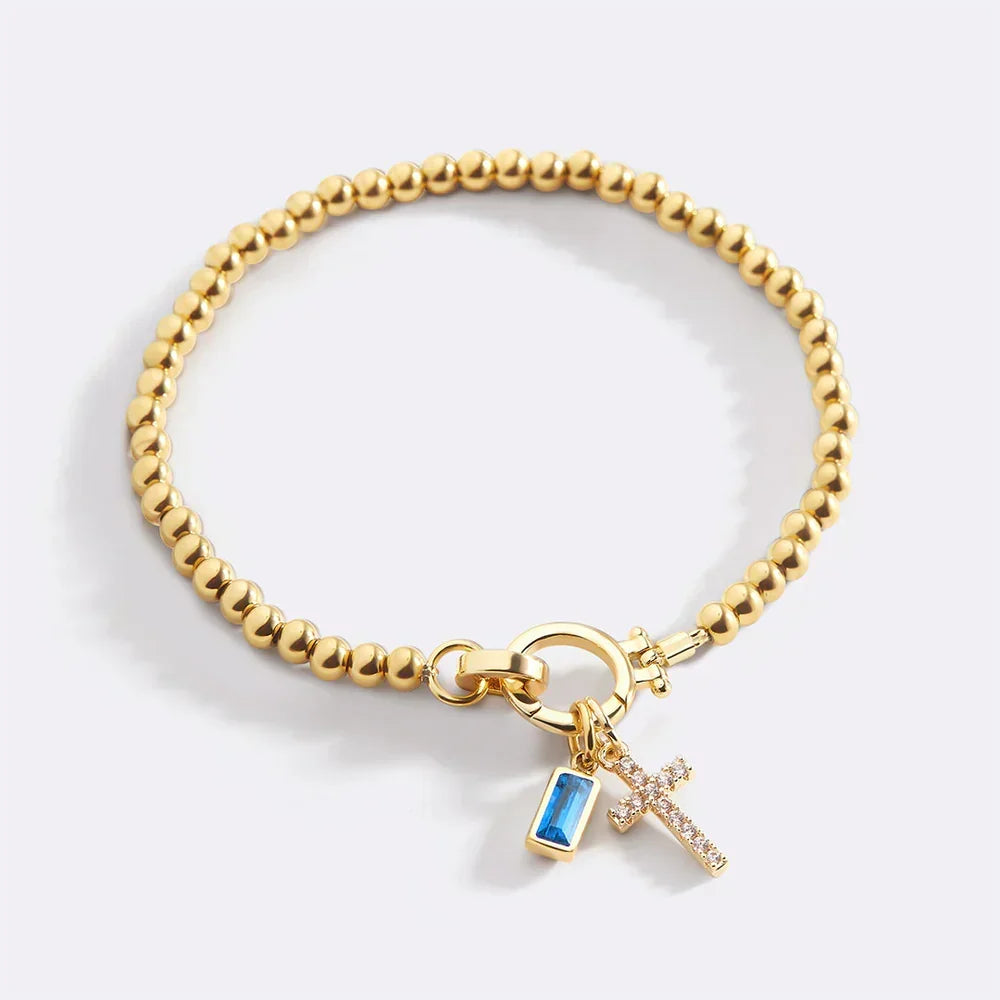 Eli – Geburtssteinarmband mit Kreuzanhänger