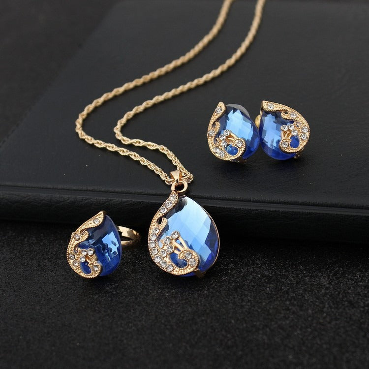 Pia – Schmuckset mit Halskette und Ohrringen aus blauem und goldenem Kristall