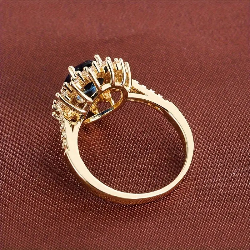 Delphine – Chic goldener Ring mit blauer Stein