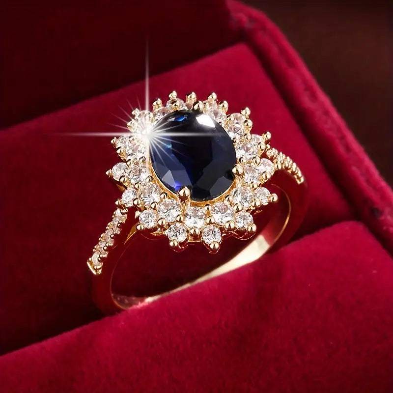 Delphine – Chic goldener Ring mit blauer Stein