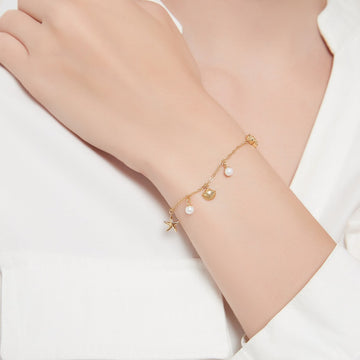 Armband mit Muschel- und Seesternanhänger